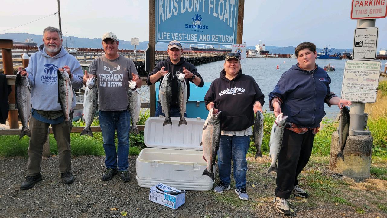 5 people holding 10 salmon in Astoria