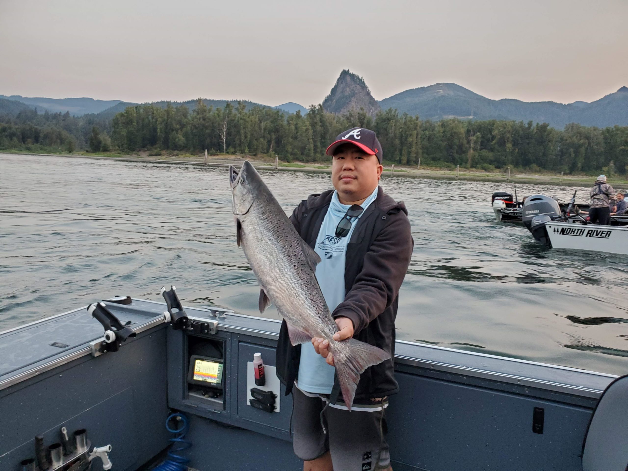 Guy holding large salmon