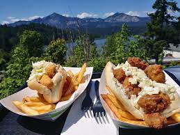 Brigham Fish Market sandwiches on outside table with beautiful view of River and mountains