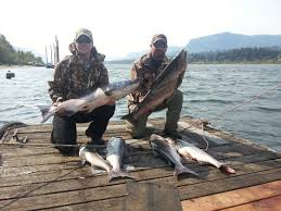 Fishery Inc dock with 2 men and 6 salmon