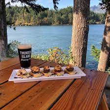 Thunder Island Brewery sliders with beer on outside table